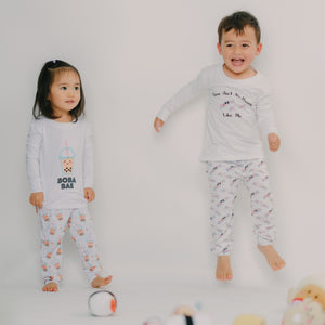 cute boy jumping with friend in the wee bean organic bamboo sleepwear pjs in bunny candy