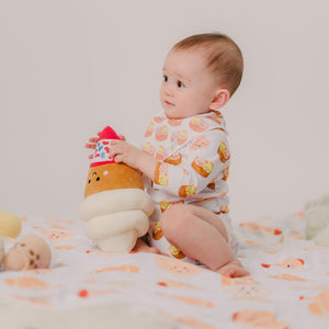 baby playing with the wee bean ice cream plushie