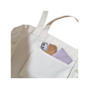 The wee bean eco-friendly canvas tote with pocket features 