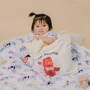 baby sitting in a tote bag on the wee bean minky blanket in white bunny candy