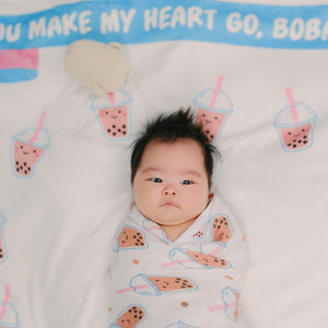 cute baby laying on boba milestone blanket by the wee bean