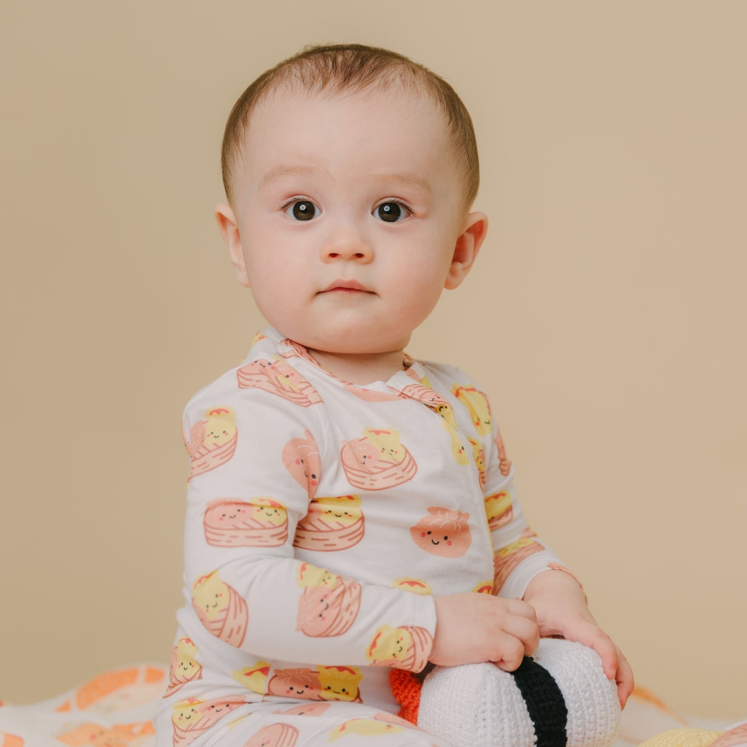 the wee bean organic cotton and bamboo blend reversible zipper footed footie romper in dim sum