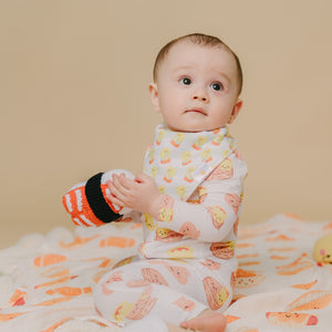 cute baby in dim sum bamboo zip romper sleepwear playing with sushi dolls