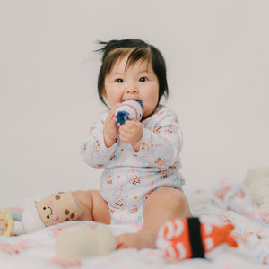 cute baby playing with the wee bean bunny candy crochet rattle doll