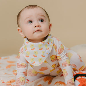 cute baby looking up in lemon tea bib