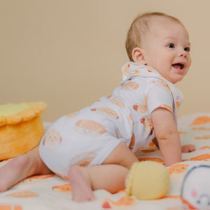 baby turning around tummy time in the wee bean hong kong bakery buns onesie