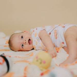 baby lying down in the wee bean hong kong bakery buns onesie