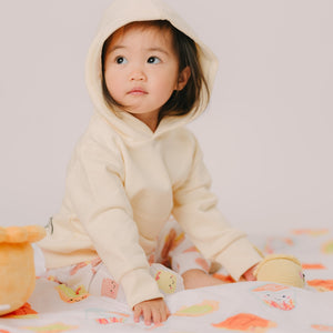 cute girl sitting on the wee bean minky blanket in cha chaan teng