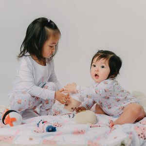 sisters playing in their boba pajamas